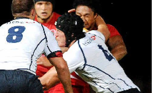 Kane Douglas (number 4) tackles the Reds. Kane Douglas (number 4) tackles the Reds.