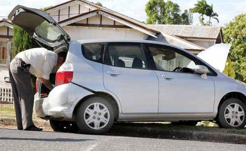 Officers search a stolen vehicle after it crashed in West Rockhampton yesterday following a police pursuit. Officers search a stolen vehicle after it crashed in West Rockhampton yesterday following a police pursuit.