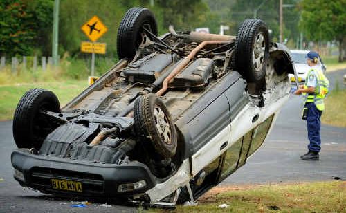 A neighbour pulled the driver clear of this overturned vehicle at the Vere and Skinner street intersection at South Grafton yesterday. A neighbour pulled the driver clear of this overturned vehicle at the Vere and Skinner street intersection at South Grafton yesterday.