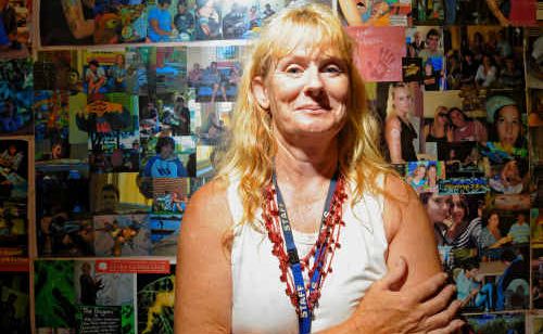 New School of Arts program coordinator Colleen Kennedy in front of photos of previous program participants.
New School of Arts program coordinator Colleen Kennedy in front of photos of previous program participants.
