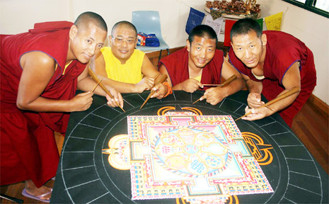 Creating the sand mandala are (from left) Dhondup Tsering, Geshe Tenzin Demchok, Thiley Dorjee and Ngawang Tashi. Creating the sand mandala are (from left) Dhondup Tsering, Geshe Tenzin Demchok, Thiley Dorjee and Ngawang Tashi.