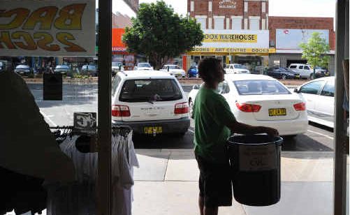 Low Pressure Surf Co owner Noel Smith with the bin he puts out for the public in Prince Street, Grafton. Low Pressure Surf Co owner Noel Smith with the bin he puts out for the public in Prince Street, Grafton.
