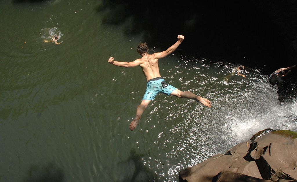 A swimmer jumps into the water at Dalwood Falls on Australia Day, 2010. A swimmer jumps into the water at Dalwood Falls on Australia Day, 2010.