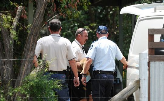 Police and a dog catcher at the scene of a dog attack at Glasshouse Mountains. A woman, 84, was attacked and one of the two dogs was shot by police at the scene. Photo: Che Chapman Police and a dog catcher at the scene of a dog attack at Glasshouse Mountains. A woman, 84, was attacked and one of the two dogs was shot by police at the scene. Photo: Che Chapman