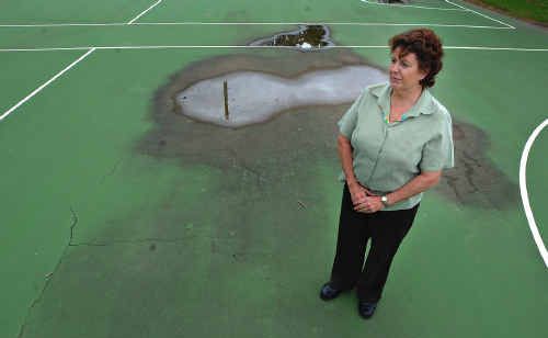 Grafton Netball Association president Cathy Walls stands on one of the dilapidated netball courts. Grafton Netball Association president Cathy Walls stands on one of the dilapidated netball courts.