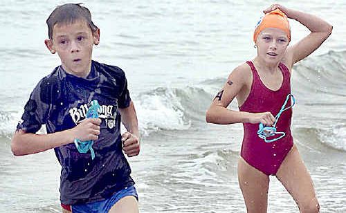 Lachlan Hopgood and Kayla Munson hit the beach in the under 10 race on Sunday. Lachlan Hopgood and Kayla Munson hit the beach in the under 10 race on Sunday.