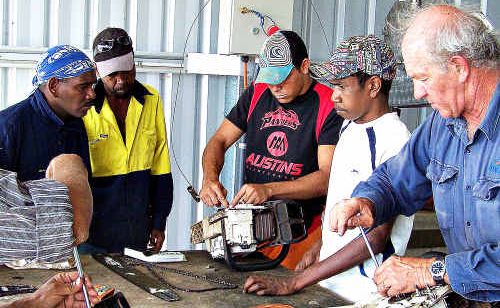 Damien Williams, Mathew Adams, Roderick Cameron and Evan Costello are instructed by Mal Sleeman on chainsaw maintenance and safety. Damien Williams, Mathew Adams, Roderick Cameron and Evan Costello are instructed by Mal Sleeman on chainsaw maintenance and safety.