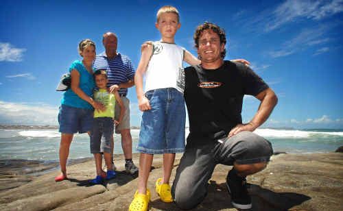 Angus Lambert was rescued by Justin Henwood at Turners Beach. Angus was swept out to sea in a rip on Thursday in three-metre swell conditions, while his family Skye, Jarrod and Glenn watched on. Angus Lambert was rescued by Justin Henwood at Turners Beach. Angus was swept out to sea in a rip on Thursday in three-metre swell conditions, while his family Skye, Jarrod and Glenn watched on.