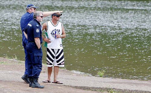Police talk to a witness. Police talk to a witness.
