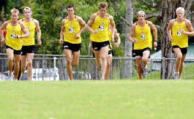 The Gold Coast AFL team in the middle of their training run at Oakes Oval, Lismore, yesterday. The Gold Coast AFL team in the middle of their training run at Oakes Oval, Lismore, yesterday.