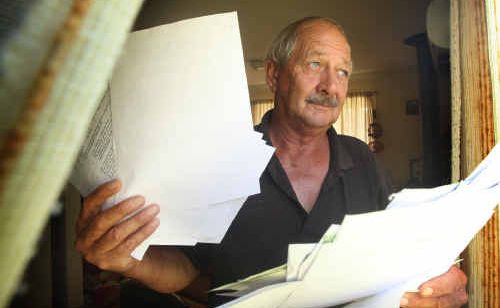 Bob McGowan, of Halfway Creek, with some of the correspondence he’s had in objecting to a nearby guard dog training centre proposed for the area. Bob McGowan, of Halfway Creek, with some of the correspondence he’s had in objecting to a nearby guard dog training centre proposed for the area.