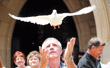 Graham Temperley releases a pigeon after the memorial service for his mother, Iris Temperley, who was murdered on Australia Day. Graham Temperley releases a pigeon after the memorial service for his mother, Iris Temperley, who was murdered on Australia Day.