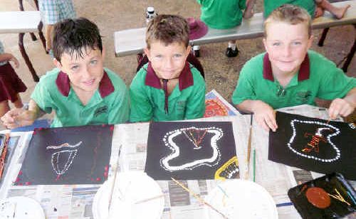 Sam Nash, 10, Jayden Younson, 8, and Max Redding, 9, mark the anniversary of Sorry Day. Sam Nash, 10, Jayden Younson, 8, and Max Redding, 9, mark the anniversary of Sorry Day.