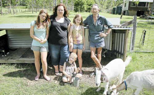 Apple Tree Creek family Hayden (front), Erin, Renee and Courtney Svendsen with neighbour Ross McLennan are fearful there will be more wild dog attacks in the Hamanns Road area. Apple Tree Creek family Hayden (front), Erin, Renee and Courtney Svendsen with neighbour Ross McLennan are fearful there will be more wild dog attacks in the Hamanns Road area.