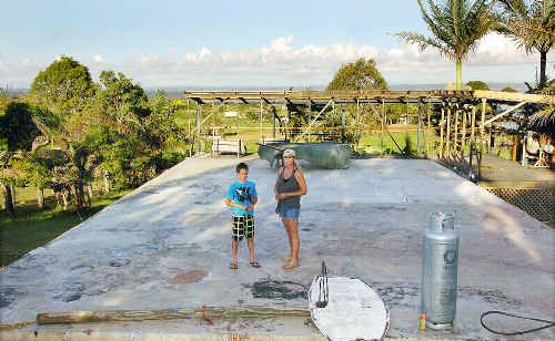 It is 12 months since the home of Sue Costin and son Kye went up in flames. Ms Costin argues that council bureaucracy is pushing back their rebuild. It is 12 months since the home of Sue Costin and son Kye went up in flames. Ms Costin argues that council bureaucracy is pushing back their rebuild.