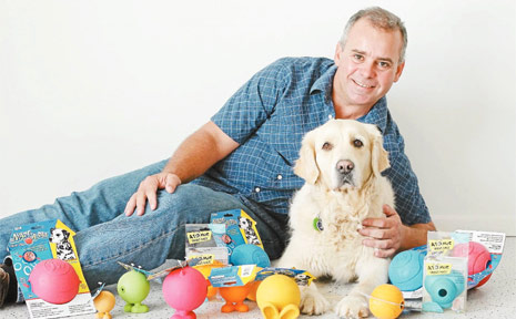 FUN TIMES: Mark Perissinotto, owner of VetShopAustrlalia.com.au, shows Ellie some safe toys for dogs to play with. FUN TIMES: Mark Perissinotto, owner of VetShopAustrlalia.com.au, shows Ellie some safe toys for dogs to play with.
