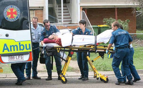A man is transported to a waiting ambulance in Vivian Street yesterday. A man is transported to a waiting ambulance in Vivian Street yesterday.