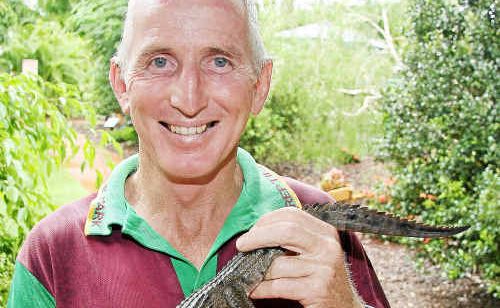 SNAKES Downunder proprietor Ian Jenkins and freshwater crocodile Bert celebrate 12 months together at the Childers reptile park. Photo: GARY HUTCHISON. BIT burt(b) 2502. SNAKES Downunder proprietor Ian Jenkins and freshwater crocodile Bert celebrate 12 months together at the Childers reptile park. Photo: GARY HUTCHISON. BIT burt(b) 2502.
