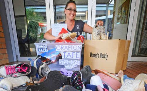 Student Association officer Angela Boorman with shoes donated to the Haiti appeal. Student Association officer Angela Boorman with shoes donated to the Haiti appeal.