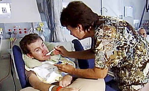Jean Byrne feeds her son Sinclair, 34, who was left in a vegetative state after an accident in Canada. Jean Byrne feeds her son Sinclair, 34, who was left in a vegetative state after an accident in Canada.