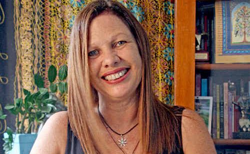 Lyn Morris shuffles cards for a tarot reading. Lyn Morris shuffles cards for a tarot reading.