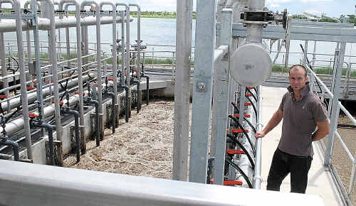 Quentin Rider checks out the effluent that is turning into “A-plus” grade water. Quentin Rider checks out the effluent that is turning into “A-plus” grade water.