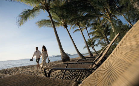 Strolling hand in hand in romantic Palm Cove. Strolling hand in hand in romantic Palm Cove.