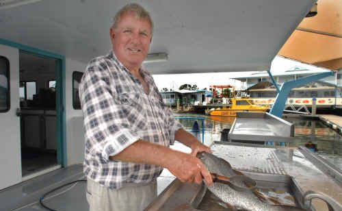 Yamba fishmonger Burr McPherson, of Burr’s Seafood, in his new location at the Yamba Marina. Yamba fishmonger Burr McPherson, of Burr’s Seafood, in his new location at the Yamba Marina.