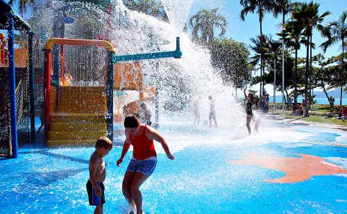 Children play in the sunshine on The Strand on Townsville’s waterfront. Children play in the sunshine on The Strand on Townsville’s waterfront.