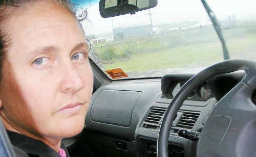 Concerned mother and motorist Catherine Pierce fears navigating through the sodden road from Freestone to Warwick during wet weather. Concerned mother and motorist Catherine Pierce fears navigating through the sodden road from Freestone to Warwick during wet weather.