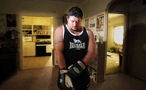 Eddie De Bono prepares for his upcoming fight at this training base - his lounge room. Photo: Adam Hourigan Eddie De Bono prepares for his upcoming fight at this training base - his lounge room. Photo: Adam Hourigan