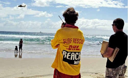 Surf Rescue crew, police, and the Westpac Rescue Helicopter combing Belongil Beach yesterday. Surf Rescue crew, police, and the Westpac Rescue Helicopter combing Belongil Beach yesterday.