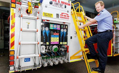 Senior firefighter Andrew Madders checks equipment on one of the trucks. Senior firefighter Andrew Madders checks equipment on one of the trucks.