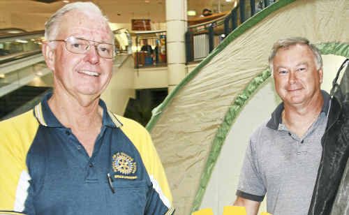 Warwick Sunrise Rotarians Bruce Fanning and Steve Moulden model a shelter box. Warwick Sunrise Rotarians Bruce Fanning and Steve Moulden model a shelter box.