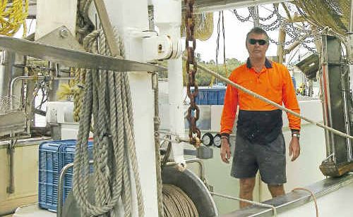 Peter Bowman securing his boat Haley in preperation of the bad weather. Peter Bowman securing his boat Haley in preperation of the bad weather.