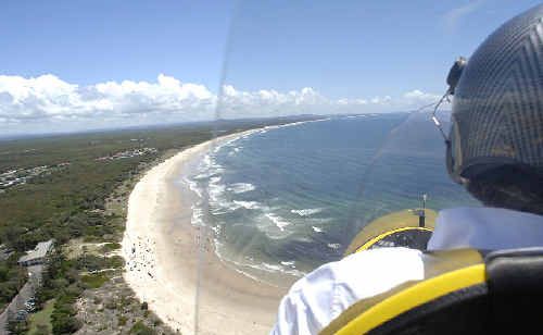 Flying instructor Peter Coulter, of East Coast Autogyro, flying over Evans Head on a shark watch patrol. Flying instructor Peter Coulter, of East Coast Autogyro, flying over Evans Head on a shark watch patrol.