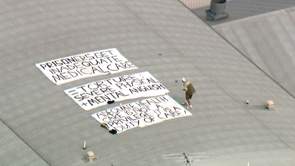 Alex Richmond-Sinclair protests on the roof of Borallon Correctional Centre. Alex Richmond-Sinclair protests on the roof of Borallon Correctional Centre.