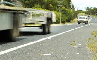 Struck out: Debris left at the scene where a man was hit by a truck on the Pacific Highway near Knockrow on Sunday night. Struck out: Debris left at the scene where a man was hit by a truck on the Pacific Highway near Knockrow on Sunday night.