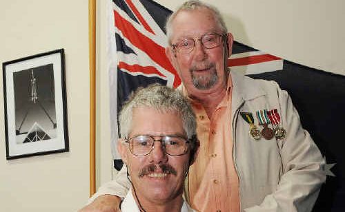 Army service medal recipient Stephen Arkell (front) of Yamba with his proud father Brian Arkell, also of Yamba. Army service medal recipient Stephen Arkell (front) of Yamba with his proud father Brian Arkell, also of Yamba.