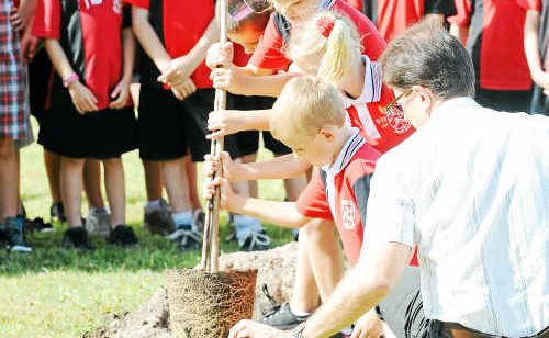 Gooburrum State School students prepare to plant a tree in memory of Trinity Bates. Gooburrum State School students prepare to plant a tree in memory of Trinity Bates.