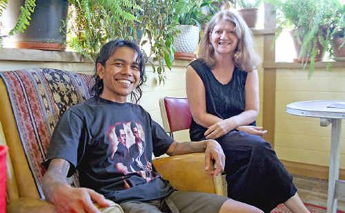 Lismore artist Aris Prabawa, a finalist in the Northern Rivers Portrait Prize, with his subject, midwife Sue Cookson. Lismore artist Aris Prabawa, a finalist in the Northern Rivers Portrait Prize, with his subject, midwife Sue Cookson.