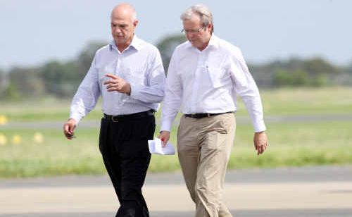 AMSA chairman Leo Zussino speaks with Prime Minister Kevin Rudd on the tarmac at Rockhampton Airport yesterday. AMSA chairman Leo Zussino speaks with Prime Minister Kevin Rudd on the tarmac at Rockhampton Airport yesterday.