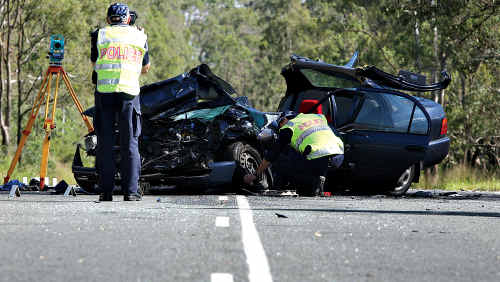 Forensic police check the details and evidence of the head-on crash west of Kilcoy yesterday. Forensic police check the details and evidence of the head-on crash west of Kilcoy yesterday.