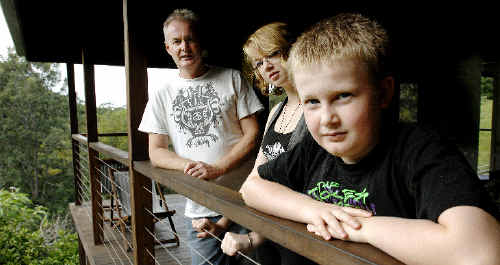 Ashley Mackinnon at their Wilsons Creek home with his two children Rebecca Kinsella, 16, and Alec Mackinnon, 10. Ashley Mackinnon at their Wilsons Creek home with his two children Rebecca Kinsella, 16, and Alec Mackinnon, 10.