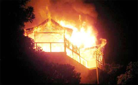 The full fury of the blaze on Sunday night is dramatically captured by Wategos resident Sean Latham. The full fury of the blaze on Sunday night is dramatically captured by Wategos resident Sean Latham.