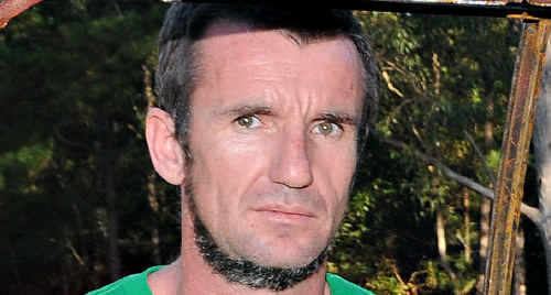 Gympie police take Allan Murray into custody on May 22 after Graeme Hughes was found dead in a Goomboorian bathtub. Gympie police take Allan Murray into custody on May 22 after Graeme Hughes was found dead in a Goomboorian bathtub.