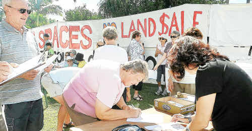 Residents sign the Save Our Space petition at Robert Garrett Street on Saturday. Residents sign the Save Our Space petition at Robert Garrett Street on Saturday.