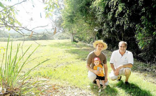 Adam Curlis, his son, Lenny, and David Wilson at the Englands Park site earmarked for Coffs Harbour’s community garden. Adam Curlis, his son, Lenny, and David Wilson at the Englands Park site earmarked for Coffs Harbour’s community garden.