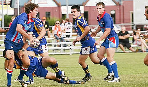 Warwick Cowboys player Luke Brosnan gets the ball away for Toowoomba. Warwick Cowboys player Luke Brosnan gets the ball away for Toowoomba.