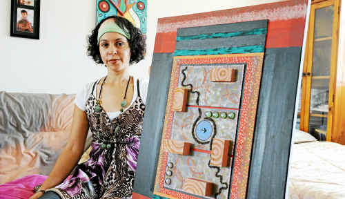 Nicole Wone is organising an Aboriginal art competition in Bundaberg. The artwork she is holding, titled Unity, is part of a two-piece work called Unity and Leadership. Nicole Wone is organising an Aboriginal art competition in Bundaberg. The artwork she is holding, titled Unity, is part of a two-piece work called Unity and Leadership.